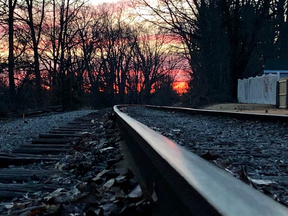 railroad
sunrise
red sky
trees