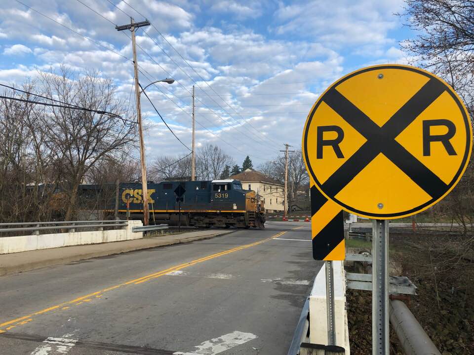 train
railroad crossing
sky
