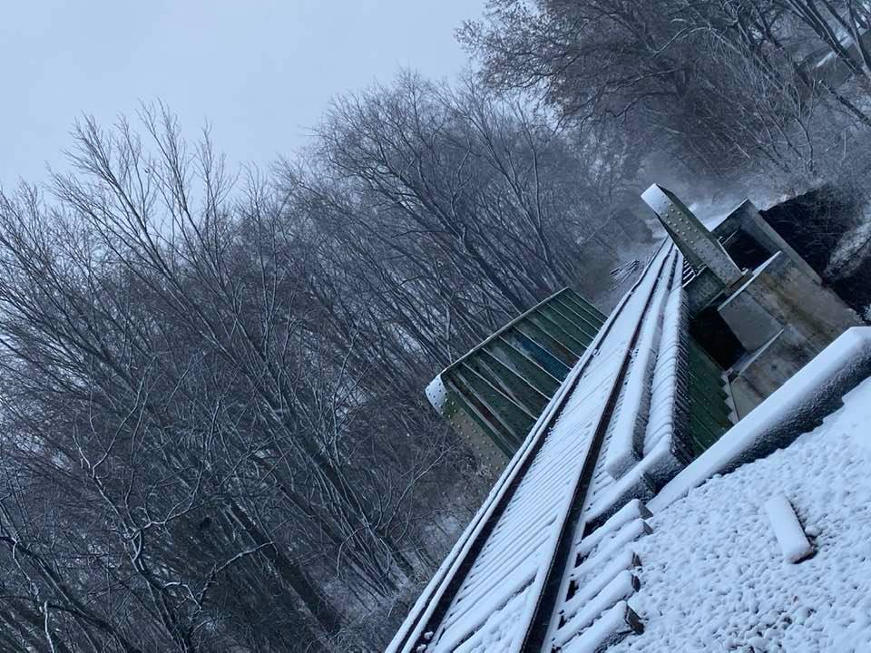 Railroad in the snow on a slant