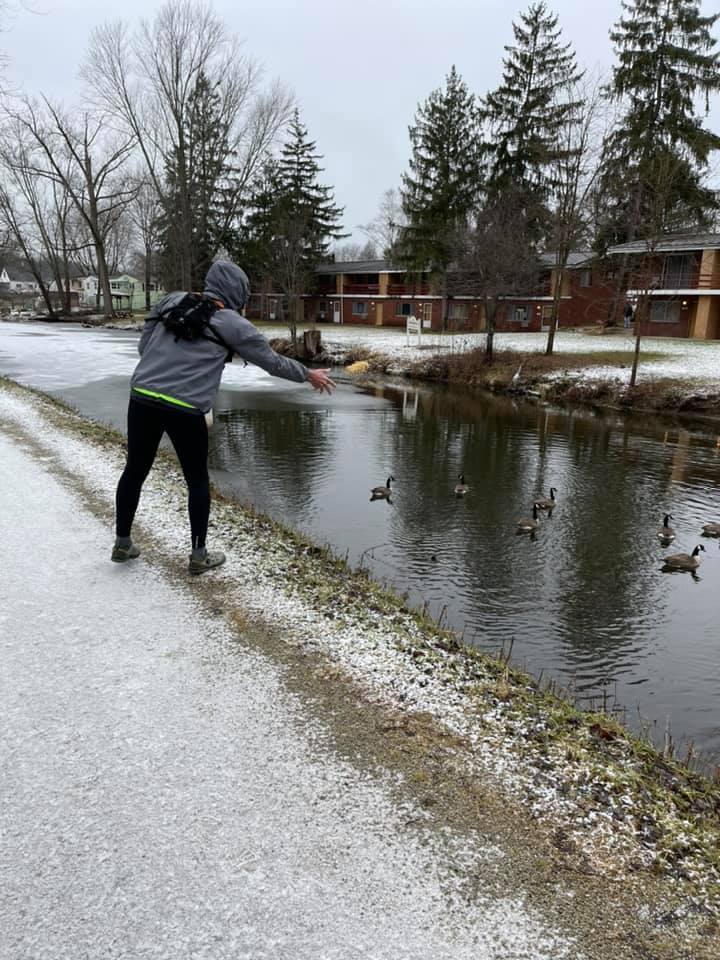 Feeding the birds by the canal