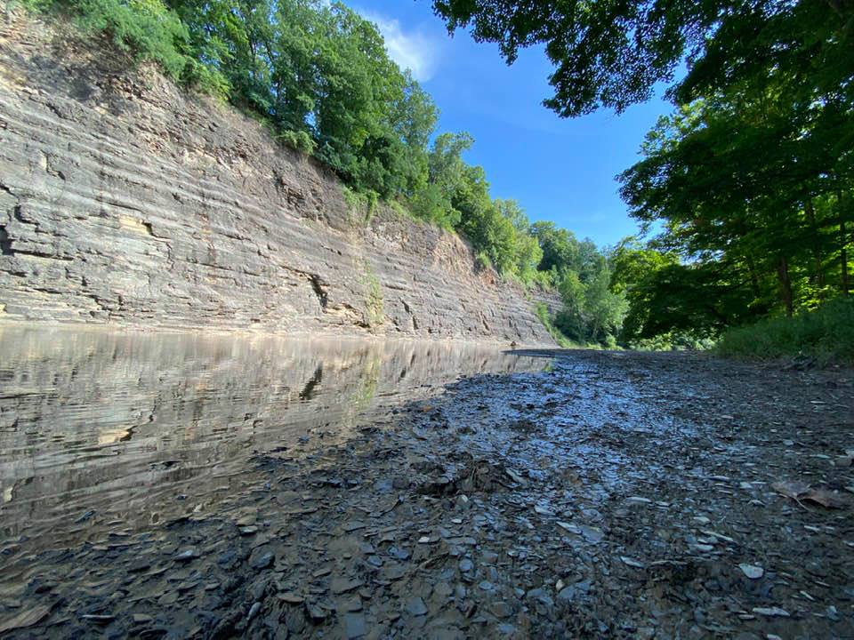 Small cliff face running alongside the river