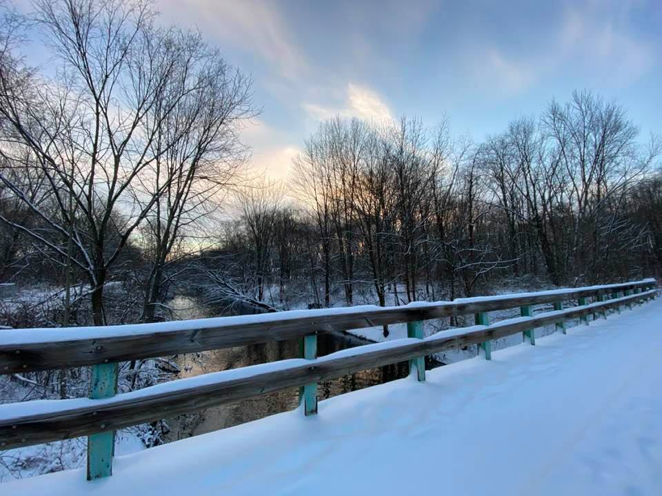 Snow on the bridge over the canal