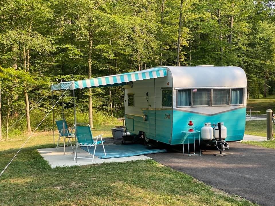 Vintage blue and white trailer with canopy