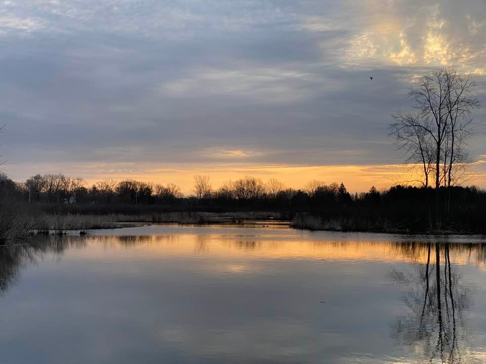 View across lake at the sunrise