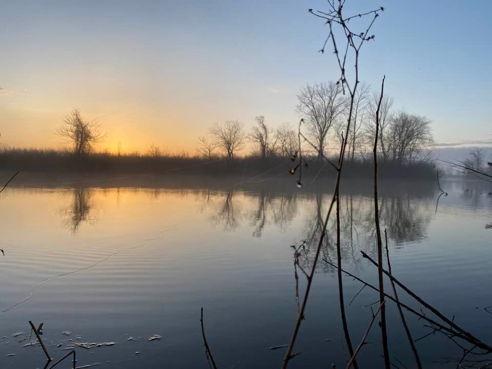 Sun coming up across the lake