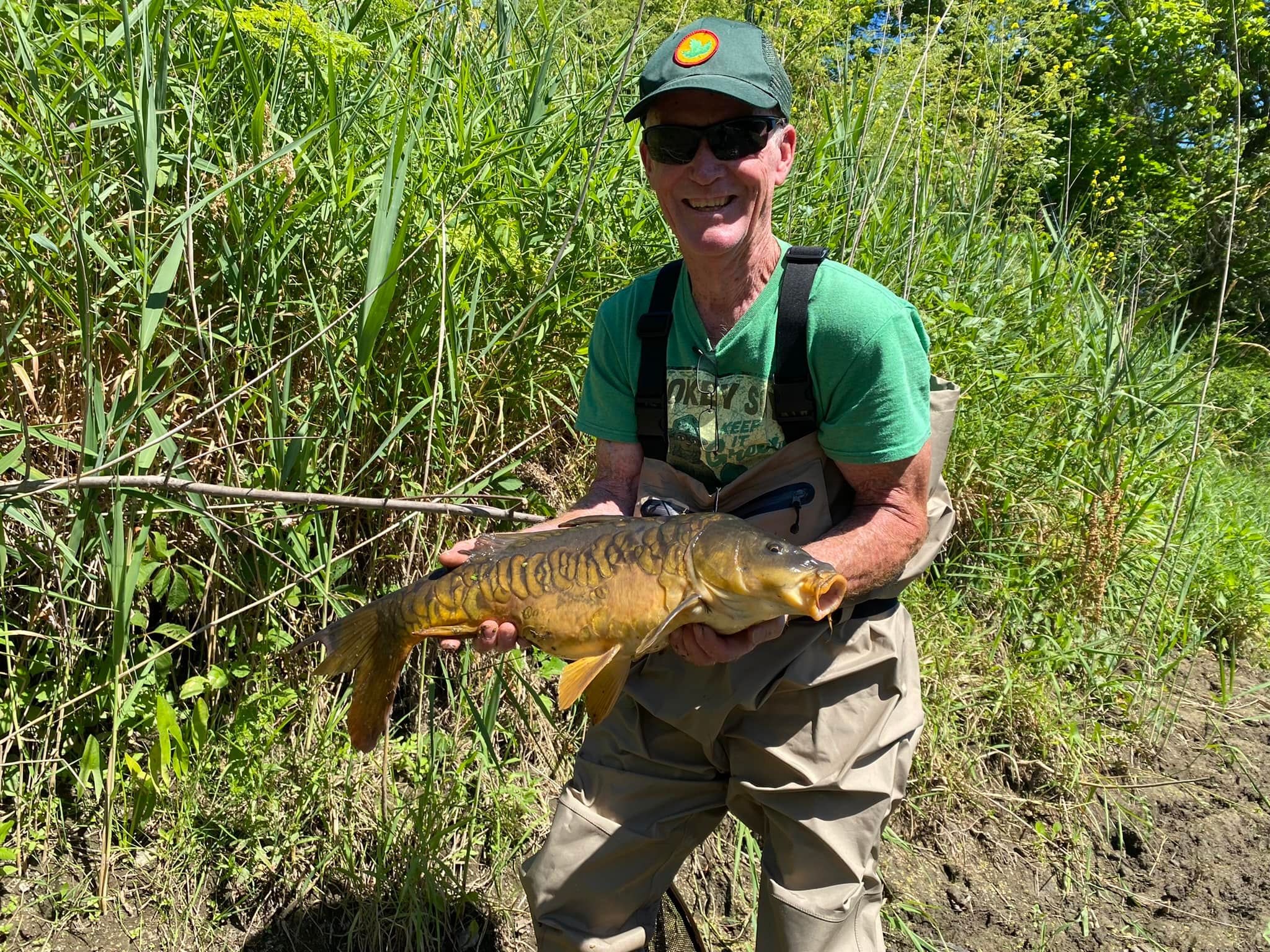 Mirror Carp being held up