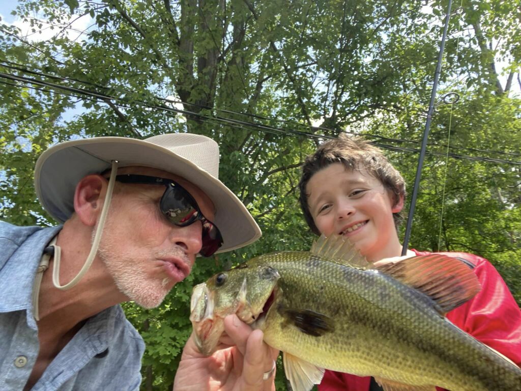 Opa Runs kissing a fish Grant caught