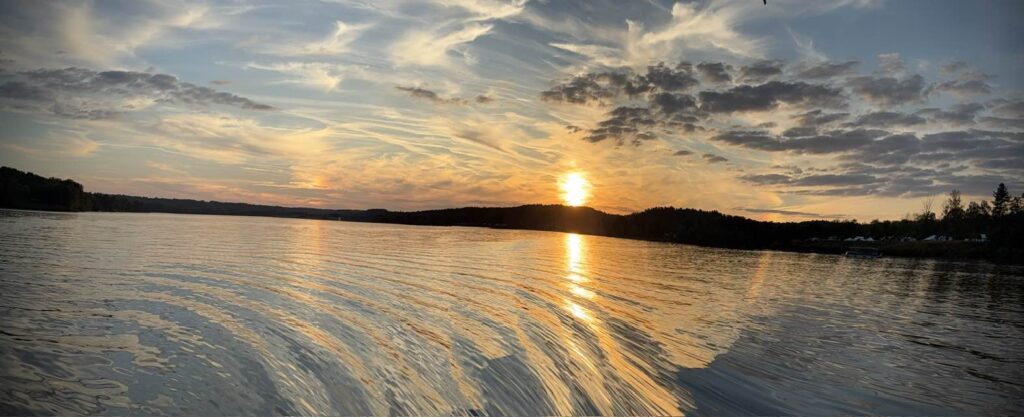 Scenic view of sunset across a lake
